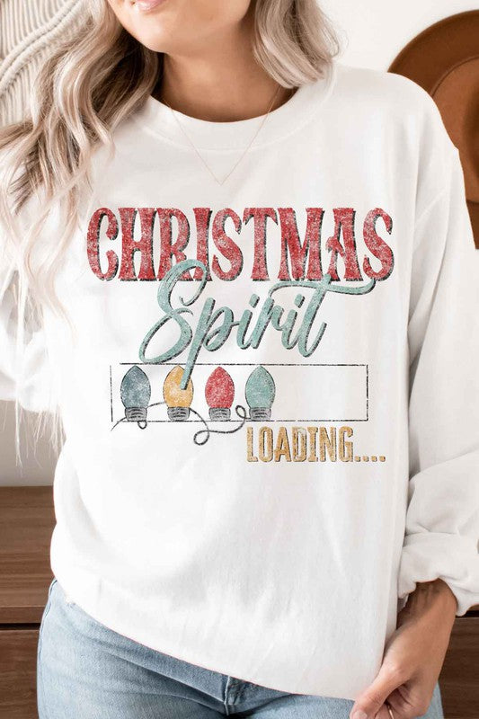 Person wearing the Loading Christmas Spirit Graphic Sweatshirt, featuring the text "Christmas Spirit Loading..." and colorful Christmas lights, perfect for your holiday wardrobe. Unisex sizing ensures a comfortable fit for everyone.