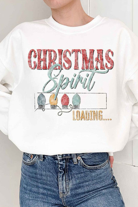 Person wearing the Loading Christmas Spirit Graphic Sweatshirt, featuring the text "Christmas Spirit Loading..." and colorful Christmas lights, perfect for your holiday wardrobe. Unisex sizing ensures a comfortable fit for everyone.