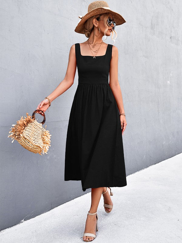 A woman in a Women's Sleeve Less Dress, featuring a vibrant red hue and crafted from 100% polyester, stands against a gray wall. She accessorizes with a wide-brimmed hat, holds a straw handbag, and complements her outfit with beige sandals.