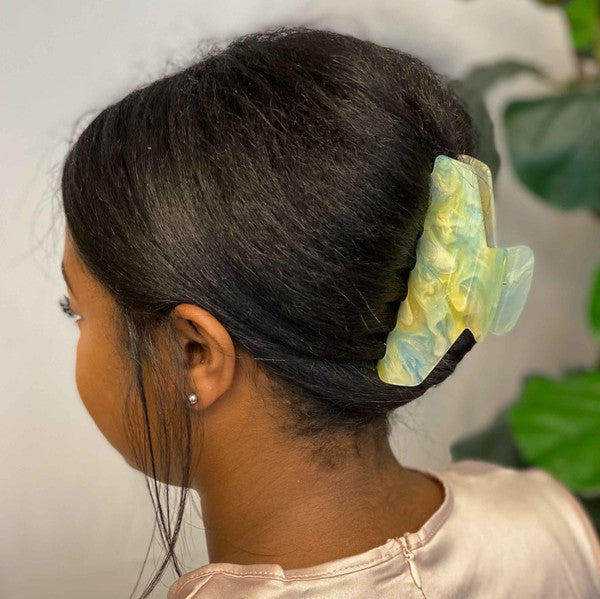 Two oversized capacity, Art Of Colors Hair Claw hair clips on a white background.