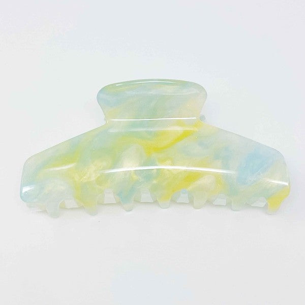 Two oversized capacity, Art Of Colors Hair Claw hair clips on a white background.