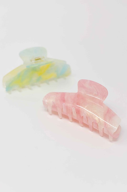 Two oversized capacity, Art Of Colors Hair Claw hair clips on a white background.