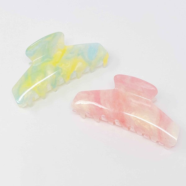 Two oversized capacity, Art Of Colors Hair Claw hair clips on a white background.