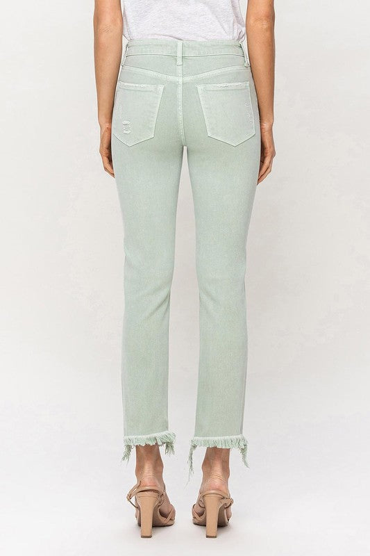 A model wearing Mid Rise Crop Straight Jeans in light green, featuring frayed hems, stands against a plain background, showcasing the jeans from waist to ankle.