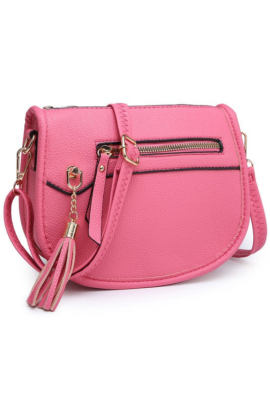 The Fashion Saddle Crossbody Bag in lavender faux vegan leather features a gold zipper, front pocket, tassel detail, and an adjustable shoulder strap.