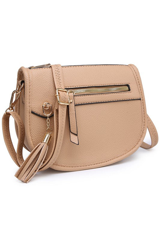 The Fashion Saddle Crossbody Bag in lavender faux vegan leather features a gold zipper, front pocket, tassel detail, and an adjustable shoulder strap.