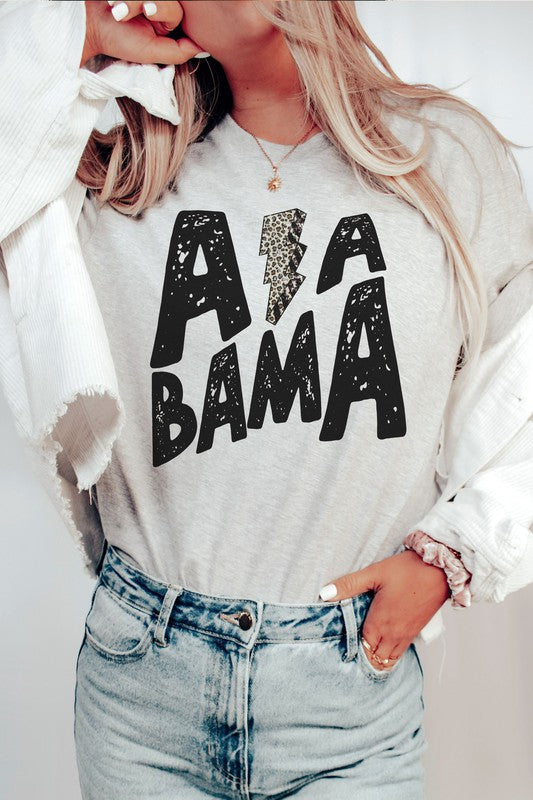 Person wearing the ALABAMA LEOPARD LIGHTNING GRAPHIC TEE, paired with distressed jeans.