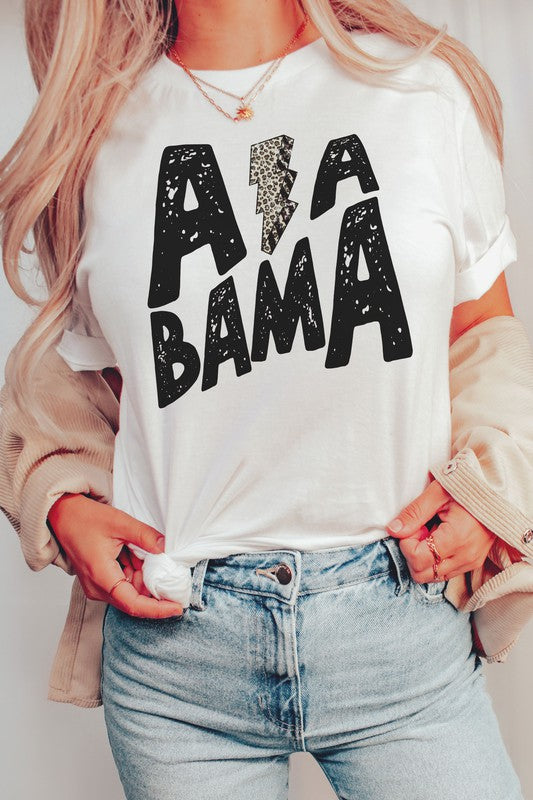 Person wearing the ALABAMA LEOPARD LIGHTNING GRAPHIC TEE, paired with distressed jeans.