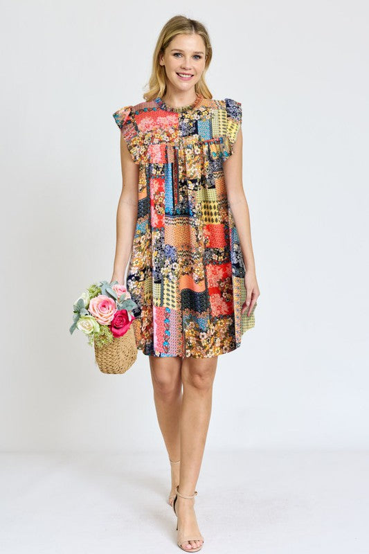 A woman in a vibrant Spring Ruffle Hem Shift Dress holds a basket of flowers while standing outdoors near steps lined with greenery.