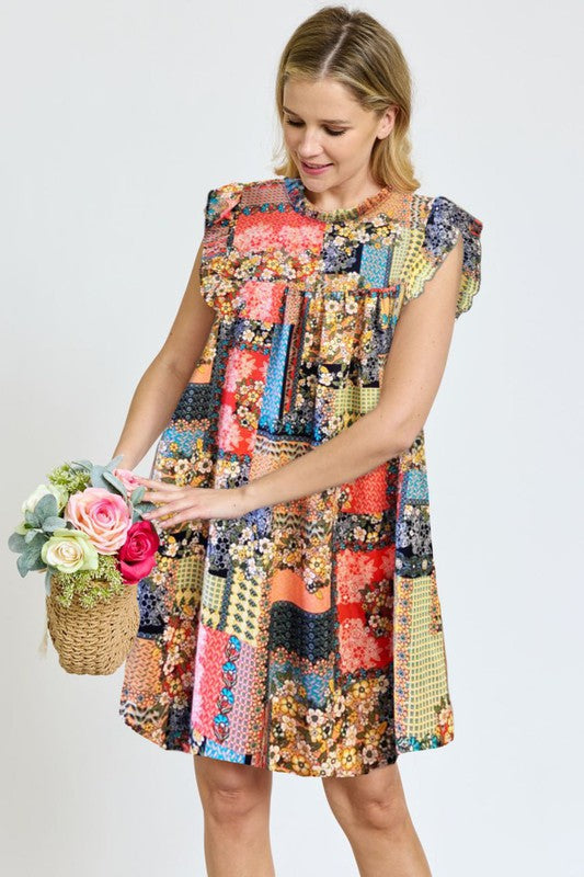 A woman in a vibrant Spring Ruffle Hem Shift Dress holds a basket of flowers while standing outdoors near steps lined with greenery.