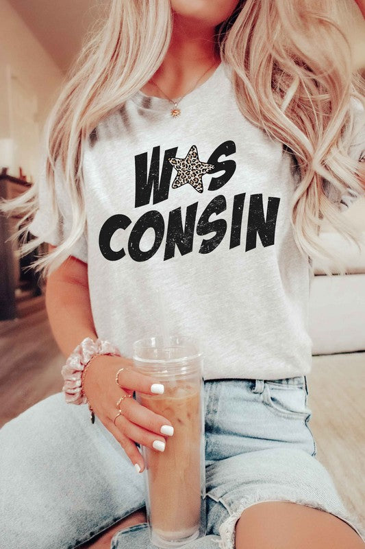 Person with long hair wearing a "Wisconsin Leopard Star Graphic Tee" holding an iced coffee.