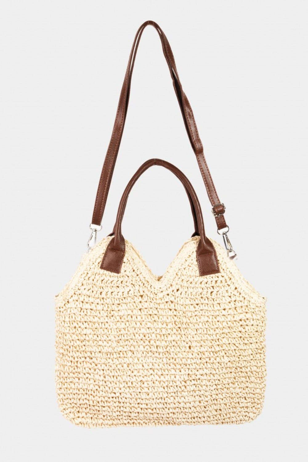 The Fame Straw Braided Faux Leather Strap Shoulder Bag, exuding bohemian charm, showcases brown faux leather handles and a matching adjustable shoulder strap against a plain white background.