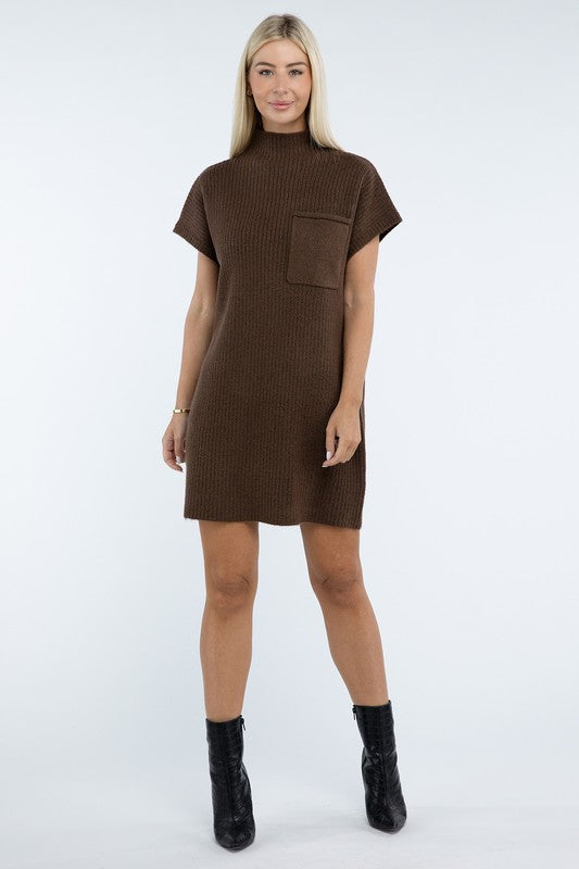 A woman stands wearing a brown Mock Neck Short Sleeve Sweater Dress with a pocket on the left side of the chest, paired with black ankle boots. She is posing against a plain white background.