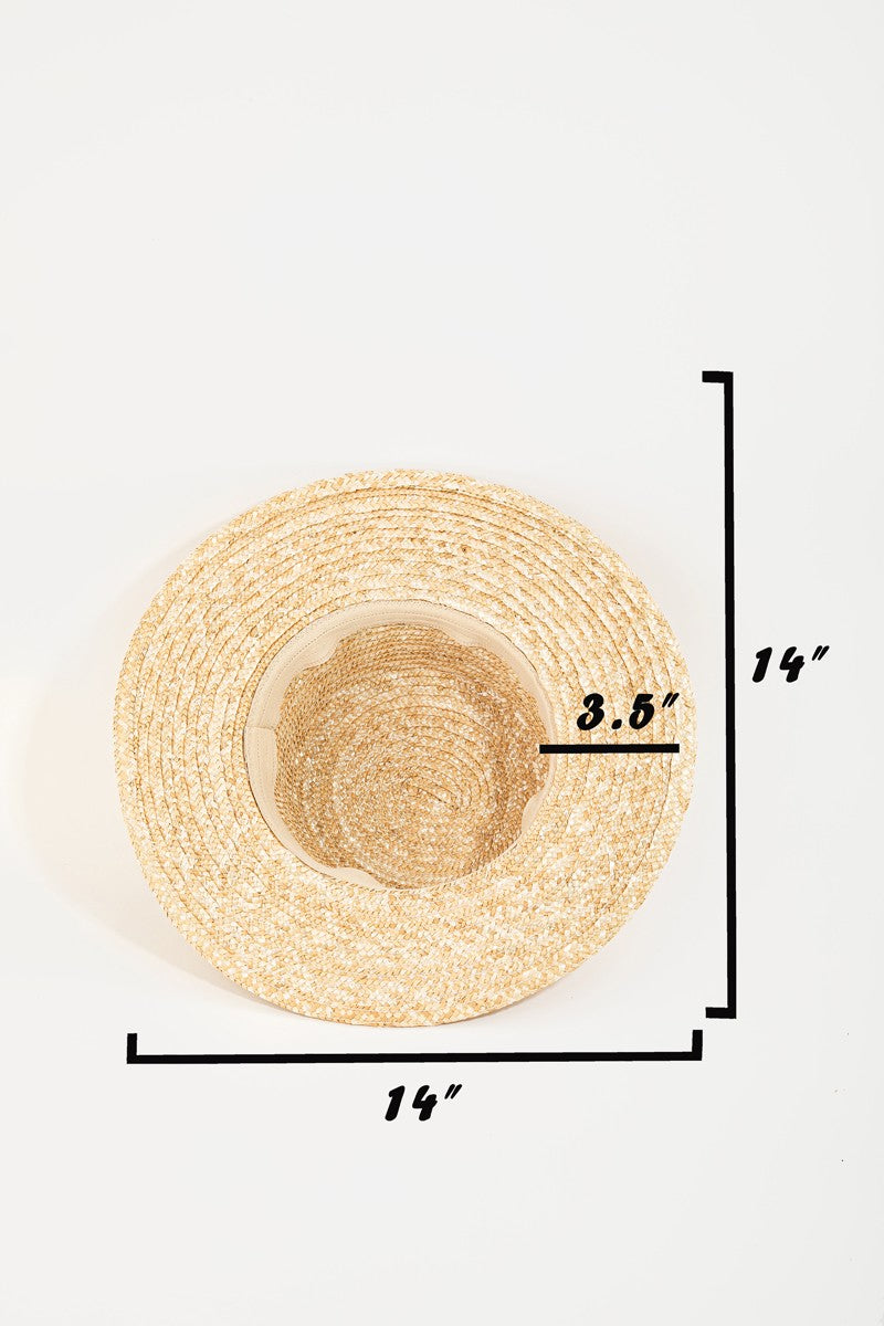 The Fame Strap Wide Brim Straw Hat, perfect for sun protection, boasts a broad brim and features a stylish black and white striped band around the crown, making it an ideal accessory for summer.