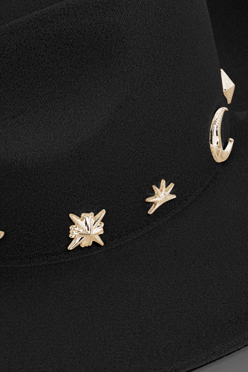 Step into style with the Fame Studded Sun Moon Star Fedora Hat, a black wide-brim piece adorned with gold geometric shapes and sun patterns on the crown, radiating celestial charm.