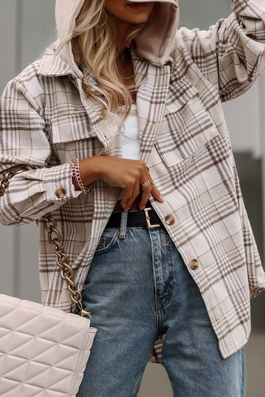 A person wearing the Plaid Removable Hood Buttoned Shacket over a white top and jeans holds a light pink handbag.