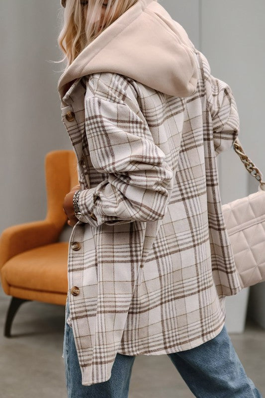 A person wearing the Plaid Removable Hood Buttoned Shacket over a white top and jeans holds a light pink handbag.