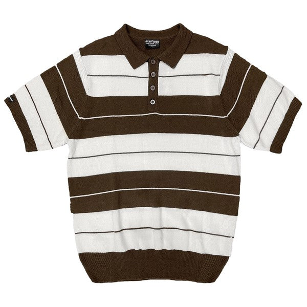 The Charlie Brown Shirt Short Sleeve Polo is a short-sleeve, polo-style shirt adorned with horizontal blue and light blue stripes. It features a buttoned collar, ribbed hem, and sleeve cuffs. Made from 100% acrylic, this design adds a touch of 1950s nostalgia to your wardrobe, reminiscent of classic Charlie Brown polos.