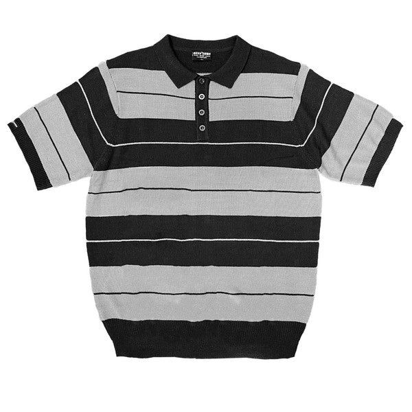 The Charlie Brown Shirt Short Sleeve Polo is a short-sleeve, polo-style shirt adorned with horizontal blue and light blue stripes. It features a buttoned collar, ribbed hem, and sleeve cuffs. Made from 100% acrylic, this design adds a touch of 1950s nostalgia to your wardrobe, reminiscent of classic Charlie Brown polos.