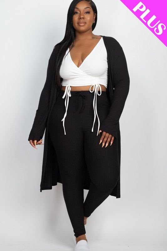 A woman wears a Plus Size Ribbed Long Cardigan & Leggings Set in beige with a white wrap top. The image features a "PLUS" label in the upper right corner.