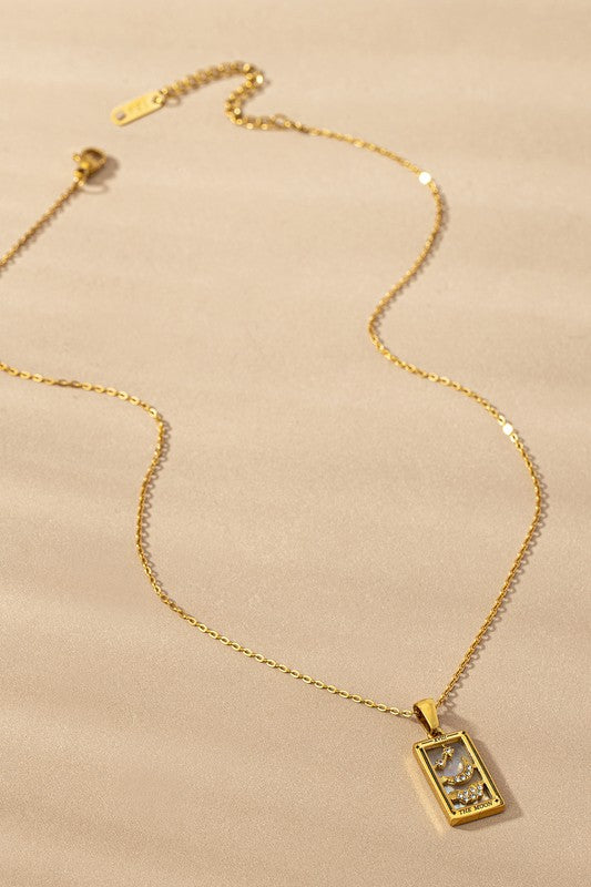 Five gold rectangular waterproof Tarot Card Natural Stone Necklaces featuring designs labeled "The Star," "The Moon," "The Sun," and "The Lovers," displayed against a beige backdrop. These exquisite necklaces include a durable PVD coating, ensuring their brilliance lasts through every wear.