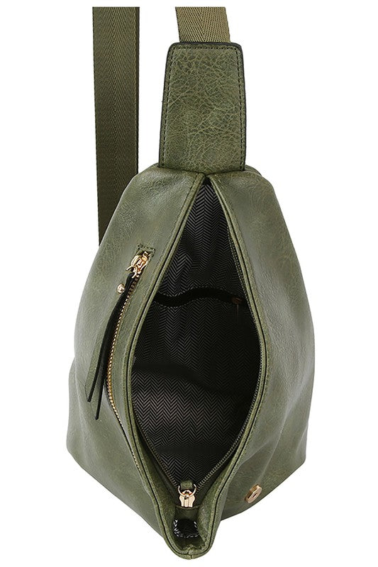 The Fashion Sling Bag Backpack, made of green faux vegan leather, showcases a single adjustable shoulder strap and two zippered compartments, displayed against a white background.