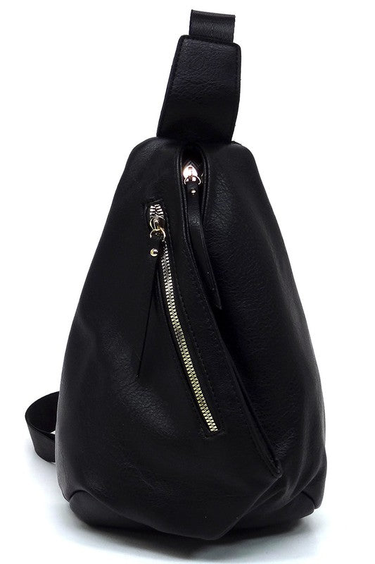 The Fashion Sling Bag Backpack, made of green faux vegan leather, showcases a single adjustable shoulder strap and two zippered compartments, displayed against a white background.