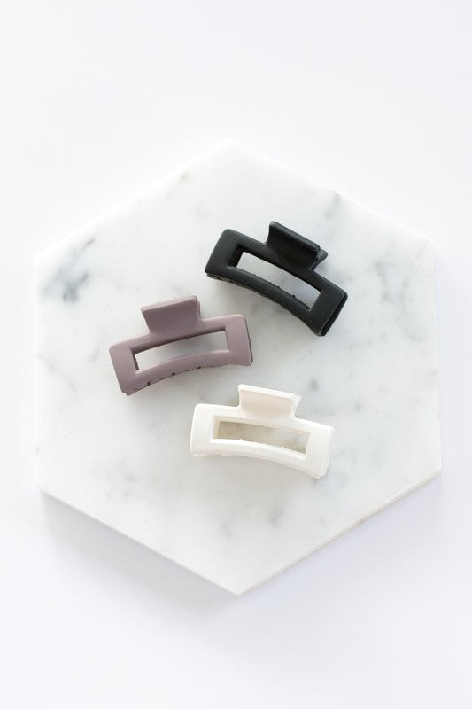 Blonde highlighted hair partially clipped up with a Mini Box Claw Set - 3 Pack.