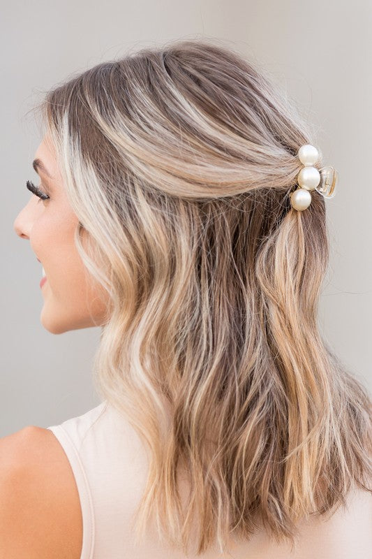 Woman with highlighted hair styled in a half-updo using a Pearl Hair Claw Clip Set - 2PK.