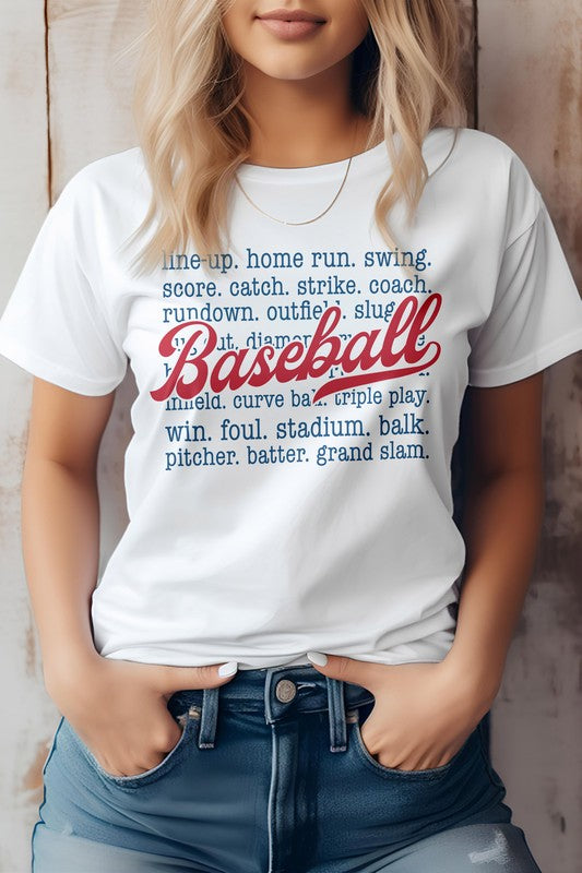 A person wearing the "Line Up, Home Run, Baseball Graphic Tee," which features baseball-related terms like "line-up," "home run," "coach," and "grand slam." The word "Baseball" is prominently displayed in red script. This t-shirt, perfect for sports enthusiasts, is made of eco-friendly materials.