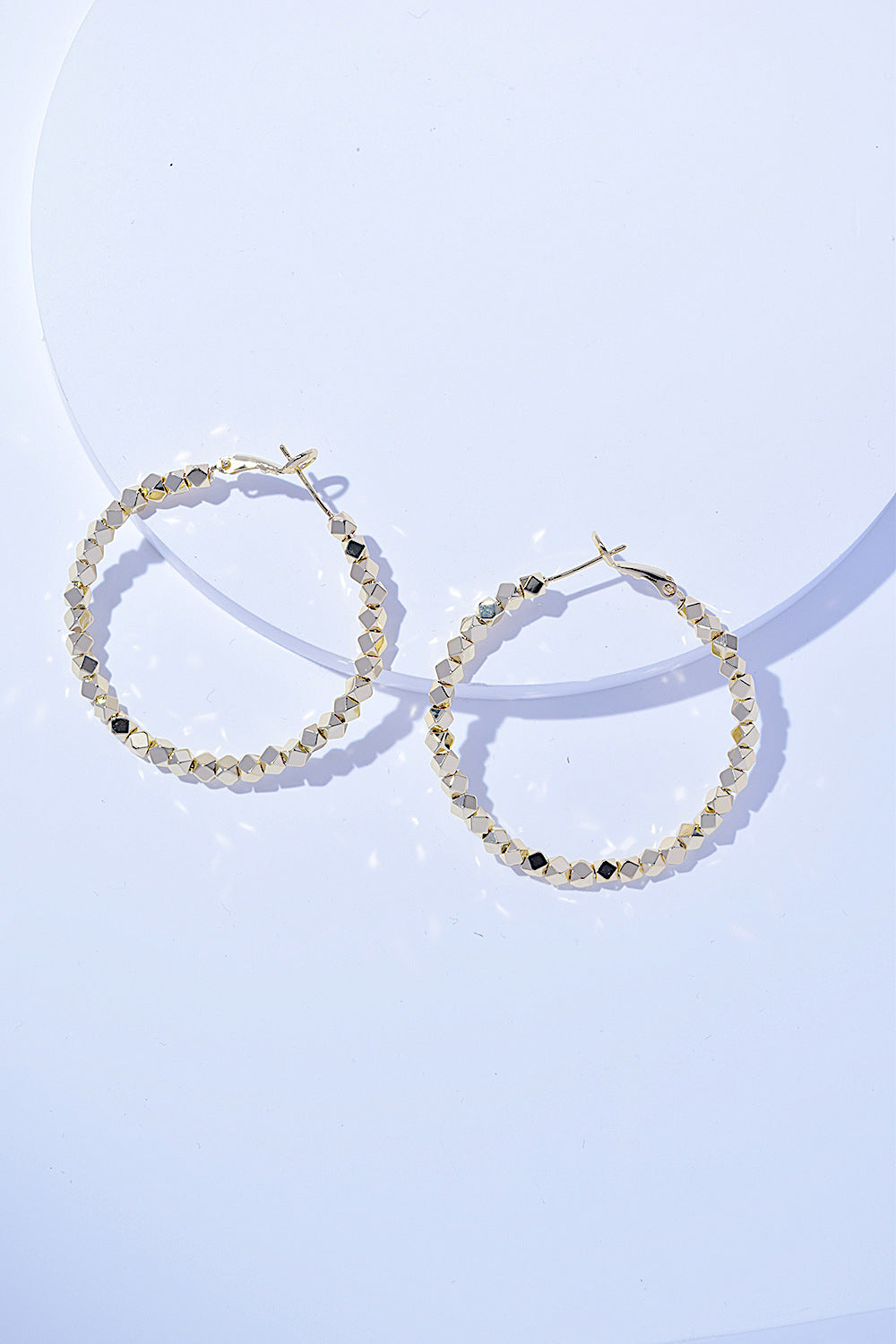 A pair of Alloy Hoop Earrings with a beaded design, displayed on a white background.