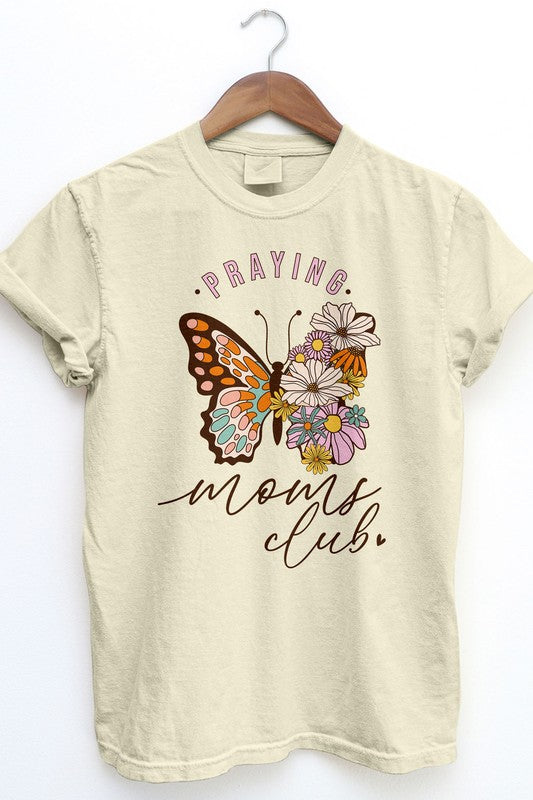 The Praying Moms Club Retro Vintage Garment Dye Tee is a beige graphic top with rolled sleeves, showcasing a vintage wash design of a butterfly and flowers, along with the text "Praying Moms Club." It's an ideal gift for Mother's Day.