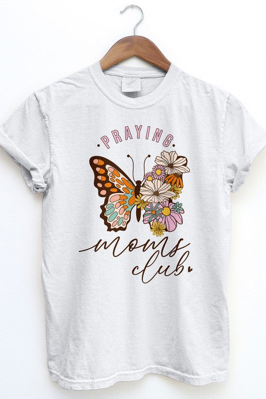 The Praying Moms Club Retro Vintage Garment Dye Tee is a beige graphic top with rolled sleeves, showcasing a vintage wash design of a butterfly and flowers, along with the text "Praying Moms Club." It's an ideal gift for Mother's Day.