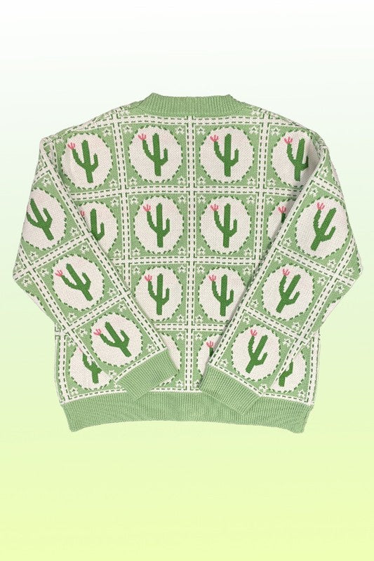 The PLUS SIZE Cactus Tiled Knit Cardigan features a V-neck, full-length sleeves, and a button-down front, adorned with a white and green cactus intarsia pattern. Perfectly tailored for plus sizing.