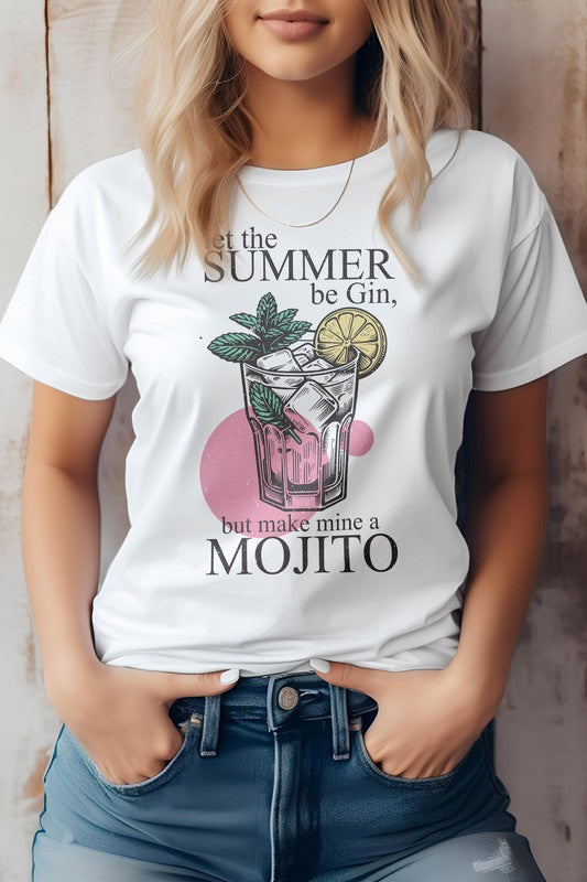 Person wearing a Vintage Summer Beach light green graphic tee featuring a party cocktail with mint leaves and a lime slice, along with the text "Let the summer be gin, but make mine a mojito." The unisex fit ensures it's perfect for anyone looking to celebrate in style.