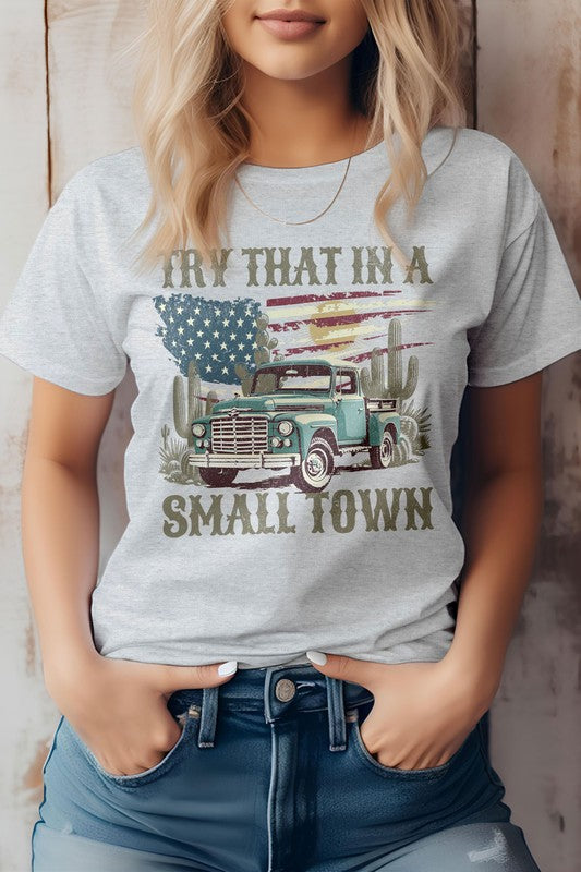 Someone wearing the "Try That in a Small Town Western Graphic Tee," which showcases a vintage truck and cacti design, truly embodies the cowboy spirit and country music charm.