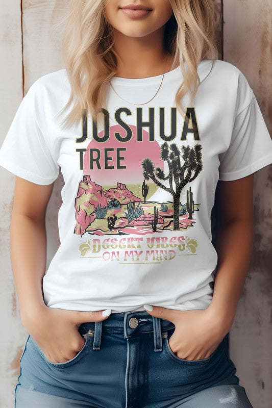 A person wearing the eco-friendly Joshua Tree National Park Graphic Tee displays a desert landscape, perfect for a camping adventure.