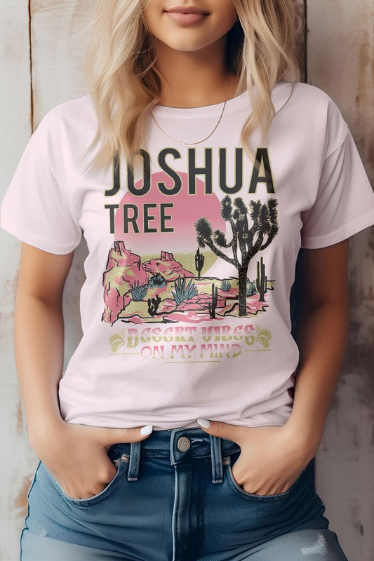 A person wearing the eco-friendly Joshua Tree National Park Graphic Tee displays a desert landscape, perfect for a camping adventure.