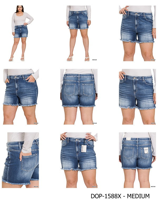 A person is wearing Zenana's Plus Mid Rise Raw Frayed Hem Denim Shorts in blue.