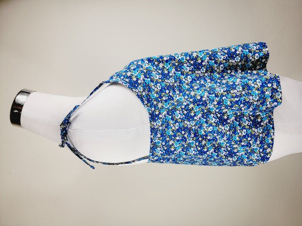 The Cotton Tank Top, a premium quality Boho tank top with adjustable straps, is displayed on a mannequin against a plain background. The sleeveless blue floral design adds an elegant touch to the garment.