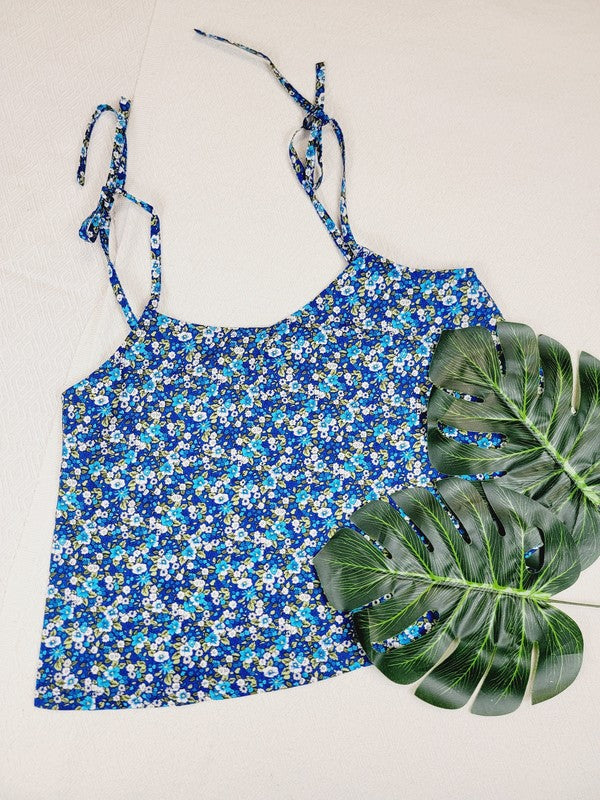 The Cotton Tank Top, a premium quality Boho tank top with adjustable straps, is displayed on a mannequin against a plain background. The sleeveless blue floral design adds an elegant touch to the garment.