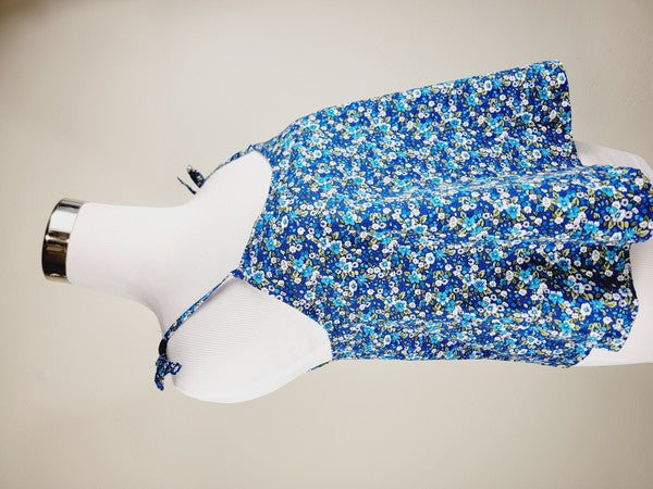 The Cotton Tank Top, a premium quality Boho tank top with adjustable straps, is displayed on a mannequin against a plain background. The sleeveless blue floral design adds an elegant touch to the garment.