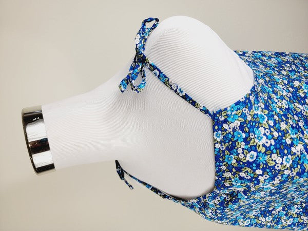 The Cotton Tank Top, a premium quality Boho tank top with adjustable straps, is displayed on a mannequin against a plain background. The sleeveless blue floral design adds an elegant touch to the garment.