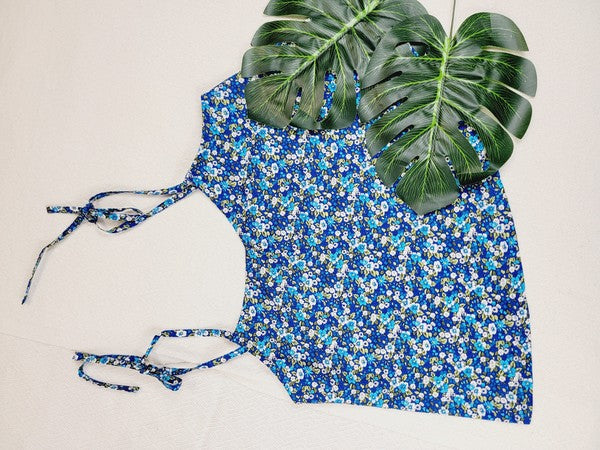 The Cotton Tank Top, a premium quality Boho tank top with adjustable straps, is displayed on a mannequin against a plain background. The sleeveless blue floral design adds an elegant touch to the garment.