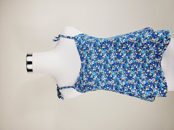 The Cotton Tank Top, a premium quality Boho tank top with adjustable straps, is displayed on a mannequin against a plain background. The sleeveless blue floral design adds an elegant touch to the garment.