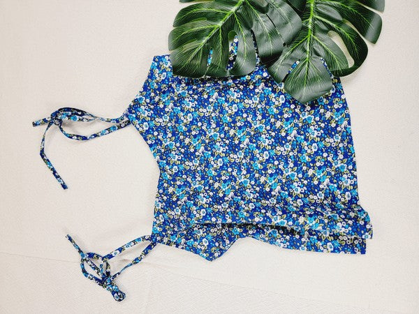 The Cotton Tank Top, a premium quality Boho tank top with adjustable straps, is displayed on a mannequin against a plain background. The sleeveless blue floral design adds an elegant touch to the garment.