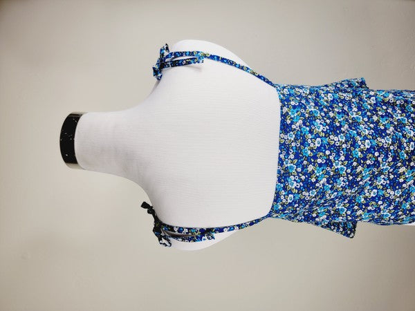 The Cotton Tank Top, a premium quality Boho tank top with adjustable straps, is displayed on a mannequin against a plain background. The sleeveless blue floral design adds an elegant touch to the garment.