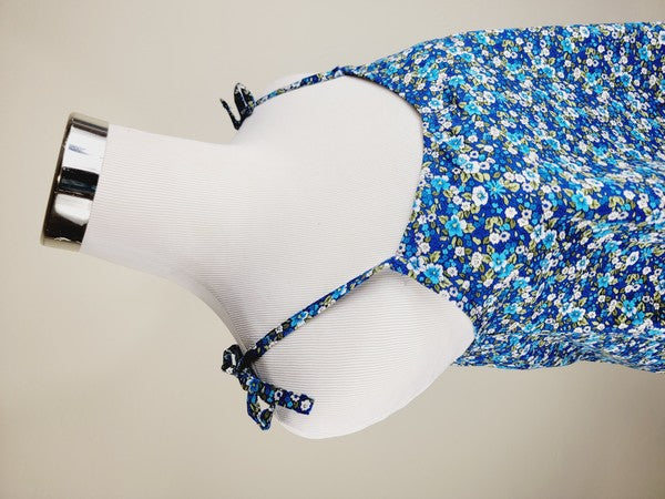 The Cotton Tank Top, a premium quality Boho tank top with adjustable straps, is displayed on a mannequin against a plain background. The sleeveless blue floral design adds an elegant touch to the garment.