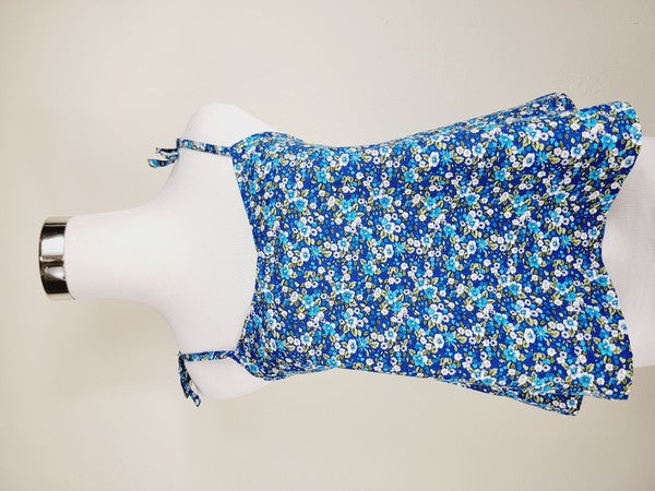 The Cotton Tank Top, a premium quality Boho tank top with adjustable straps, is displayed on a mannequin against a plain background. The sleeveless blue floral design adds an elegant touch to the garment.