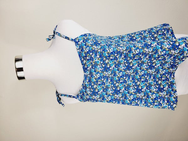 The Cotton Tank Top, a premium quality Boho tank top with adjustable straps, is displayed on a mannequin against a plain background. The sleeveless blue floral design adds an elegant touch to the garment.